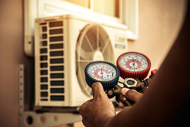 Professional Hvac Maintenance technician working in Puryear, TN